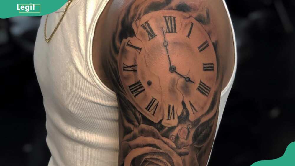 Arm clock tattoo