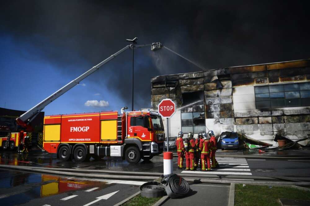 A hundred firefighters brought the blaze under control by mid-afternoon, the fire brigade said