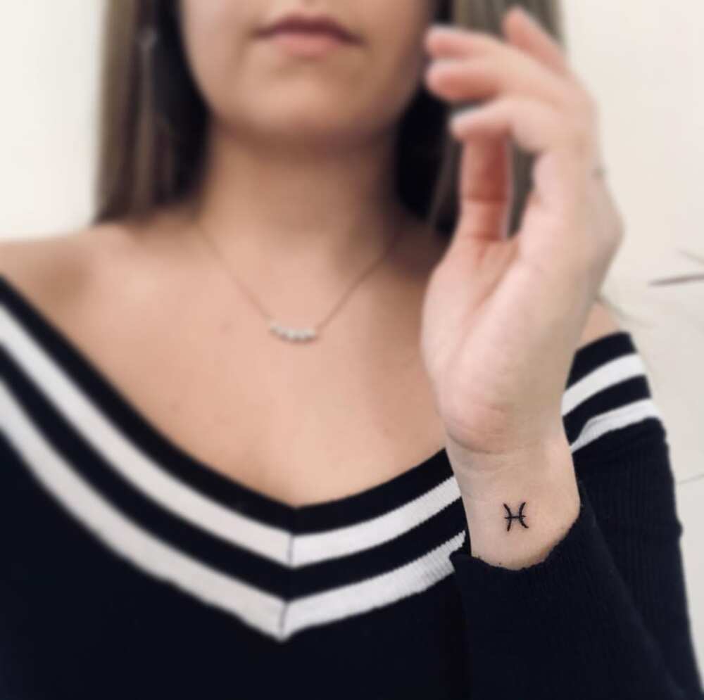 Pisces sign tattoo Pisces sign tattoo