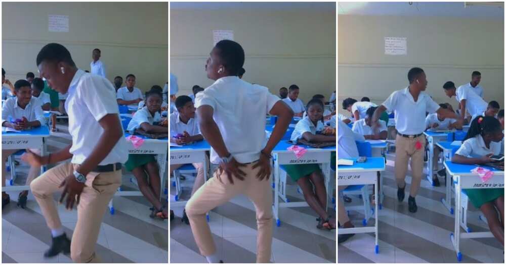 Schoolboy in uniform dances in class, student in uniform dances in front of the class, boy dancves inn school