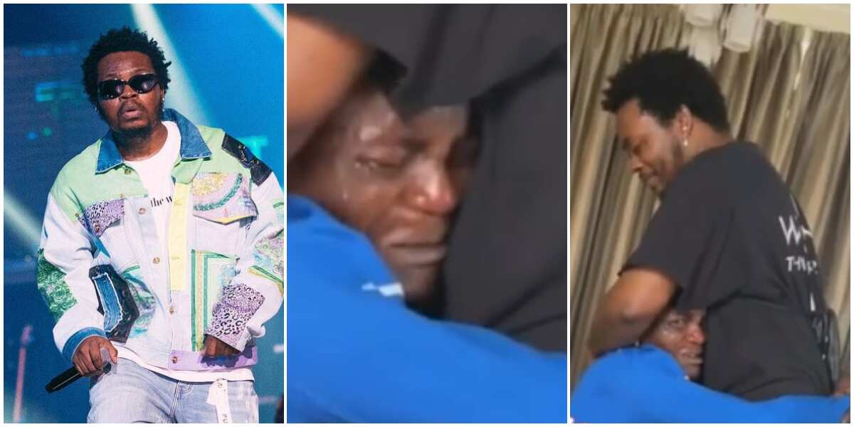 Olamide makes upcoming star cry profusely in emotional video as young man refuses to let rapper go