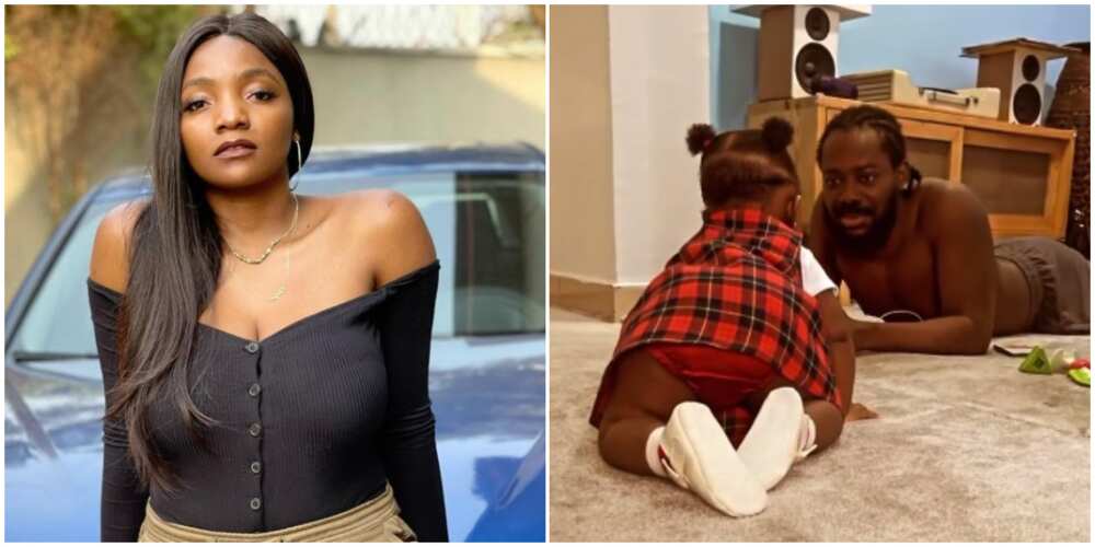 Fans in awe as of Simi and Adekunle Gold's daughter crawls, poses for photo in new video