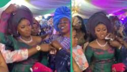 Bride's sister prevents lady from spraying money on her at wedding, video gets Nigerians talking