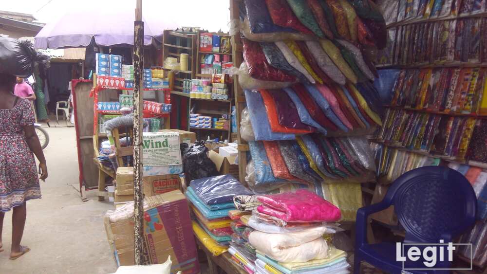 Lace, ankara, guinea fabrics on display in popular Lagos market. Photo credit: Esther Odili