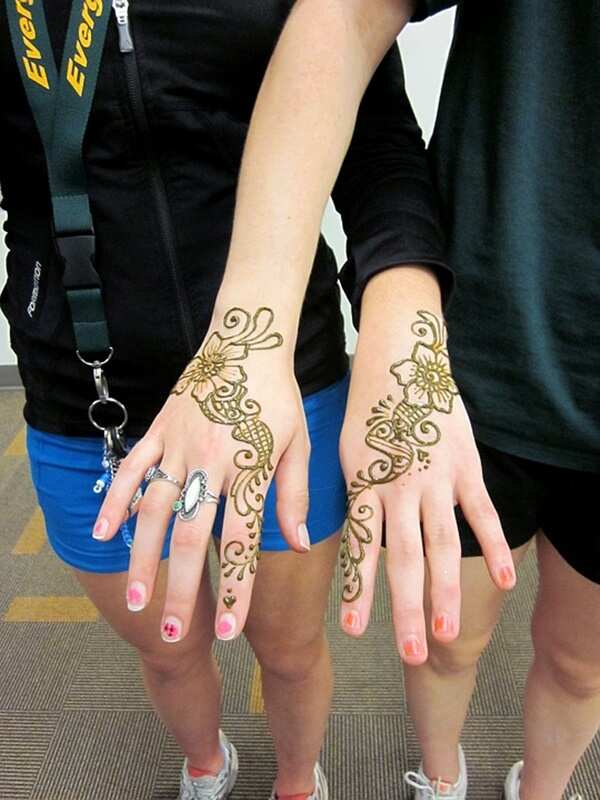 Elegant twin henna tattoos