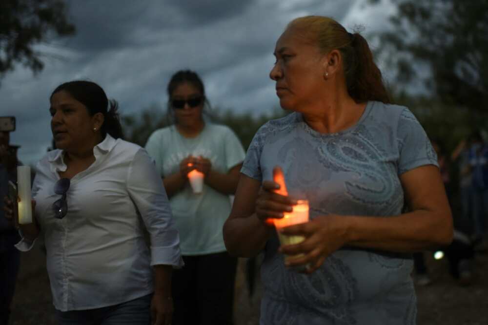 Friends and relatives hold a candlelit vigil for 10 trapped Mexican miners