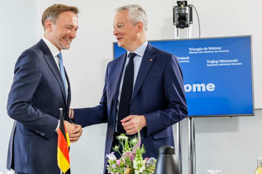German Finance Minister Christian Lindner (L) and French counterpart Bruno Le Maire chat prior to a meeting in June 2023