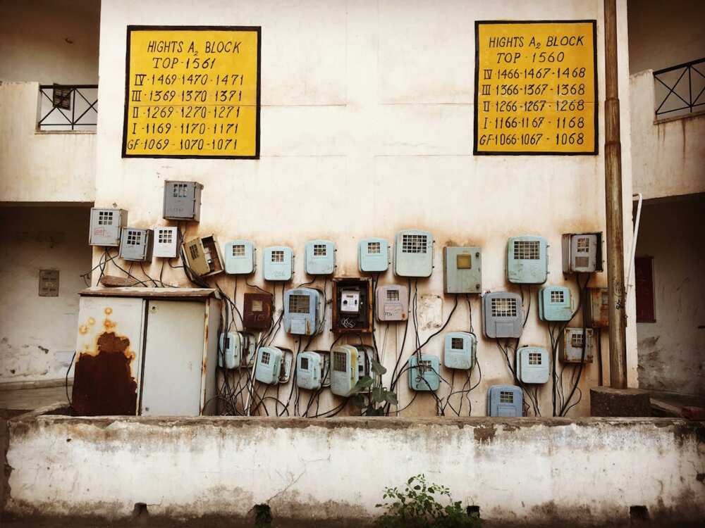 Meter boxes connected  a partition  of an aged  building