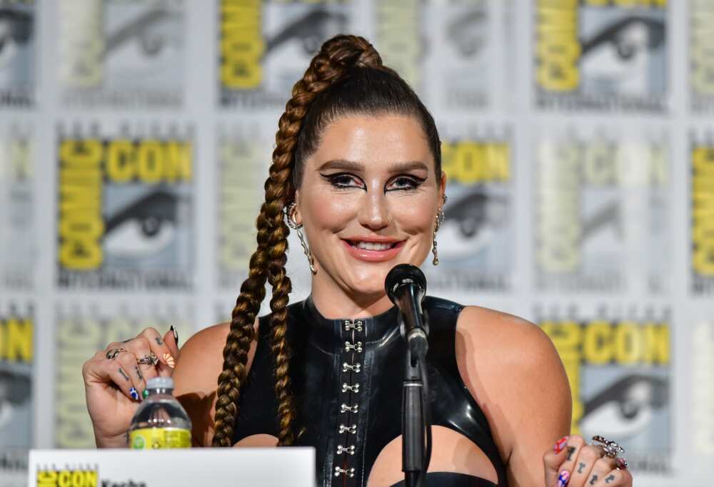 Kesha speaks onstage astatine  the Discovery+ "Conjuring Kesha" panel