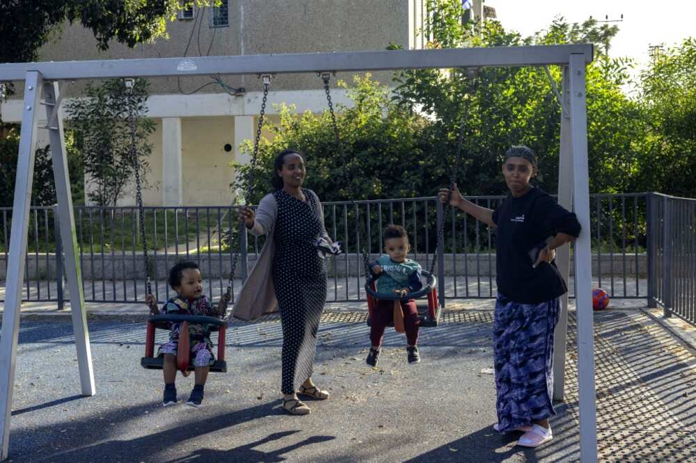 Ladies folks swing young of us at a playground in Ashkelon Ladies folks swing young of us at a playground in Ashkelon