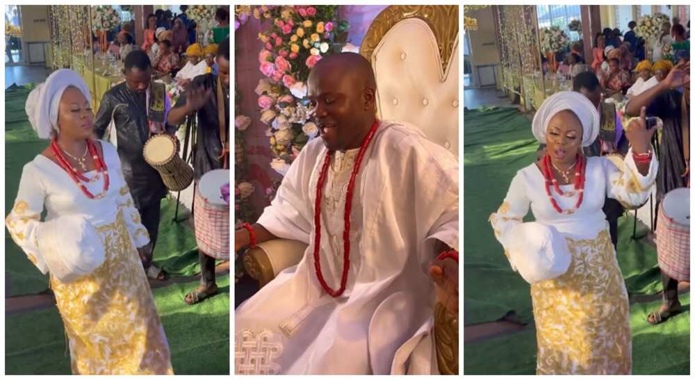Nigerian room dances while sitting on his chair while bride shows of cool dance steps on stage.