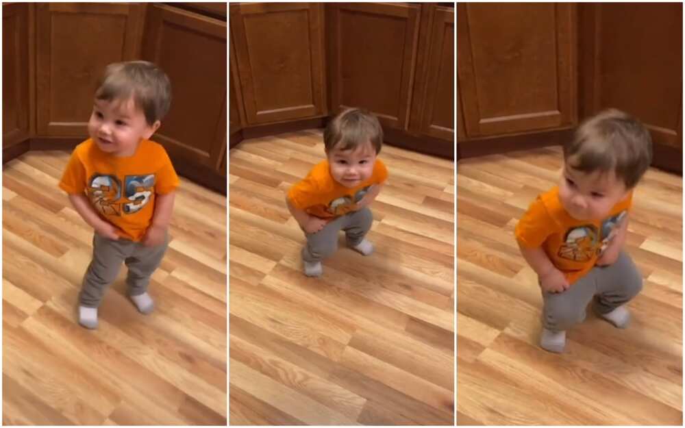 Little baby boy in orange dress uses beautiful dance to distribute joy to his audience