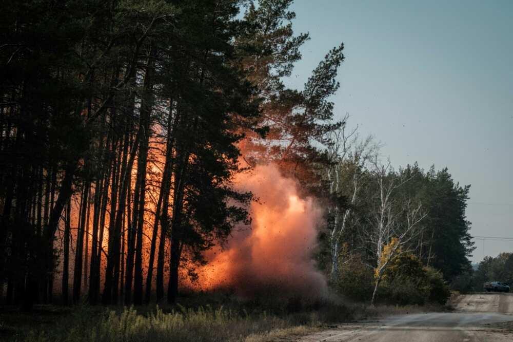 Collected anti-tank mines and explosives are detonated by the Ukrainian national police emergency demining team near the recently retaken town of Lyman in Donetsk region