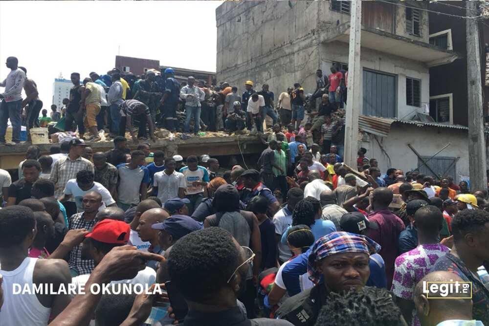 Breaking: Locals pelt Ambode as governor visits scene of building collapse