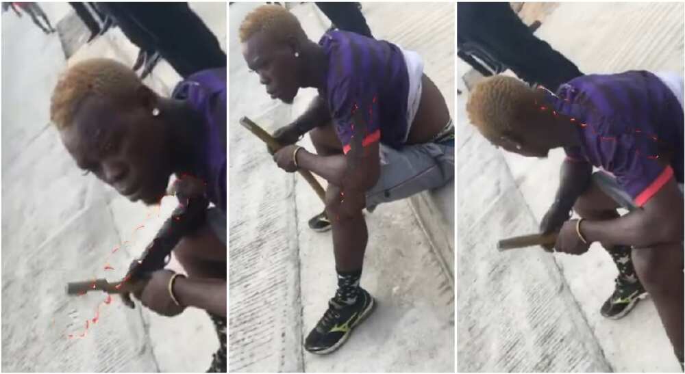 Young Nigerian man seen with long eyelashes and shiny earrings in viral video.