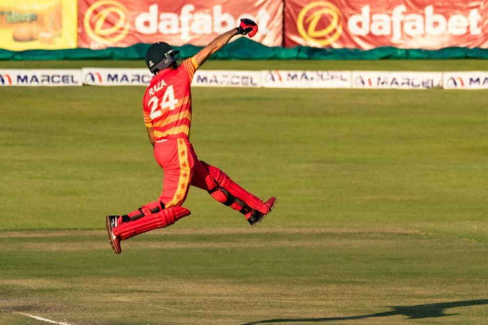 Zimbabwe's Sikandar Raza celebrates after reaching his century in the first ODI against Bangladesh in Harare