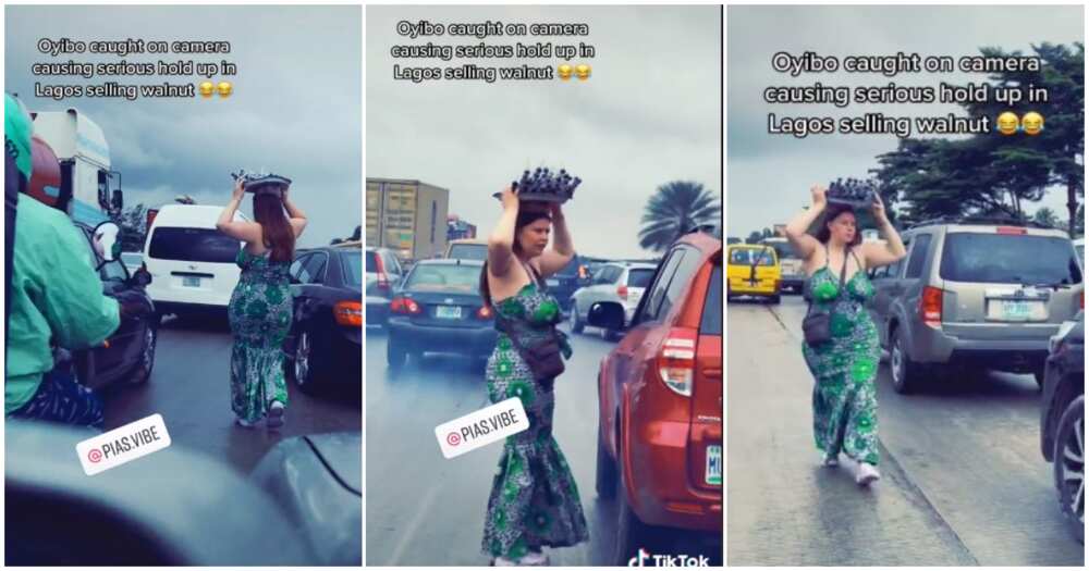 Oyinbo lady hawking in Lagos traffic, Oyinbo spotted hawking in traffic, Oyinbo lady hawking walnut in Lagos, Oyinbo hawker in Lagos