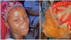 Lady's braided wig in viral video leaves internet users amused: "Just wear your own hair"