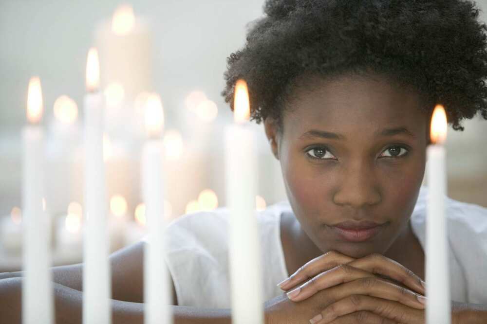 Wife, praying by candlelight Wife, praying by candlelight