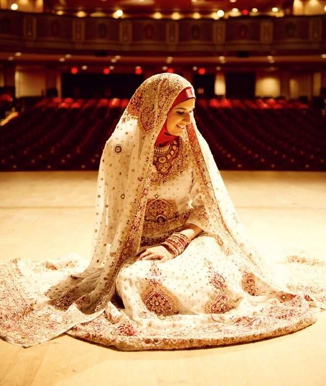 Indian brides ; Muslim bride ; wedding pink dress ; marriage costume gold  jewelry ; namaste welcome greeting hand folded posture ; India; Asia;  MR#144 Stock Photo - Alamy