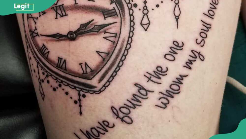 Clock with a quote tattoo