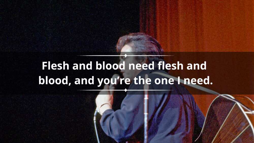 Johnny Cash performs onstage in 1973