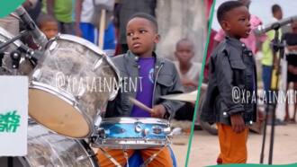 5-year-old boy drums excellently on the street of Lagos, people gather around him