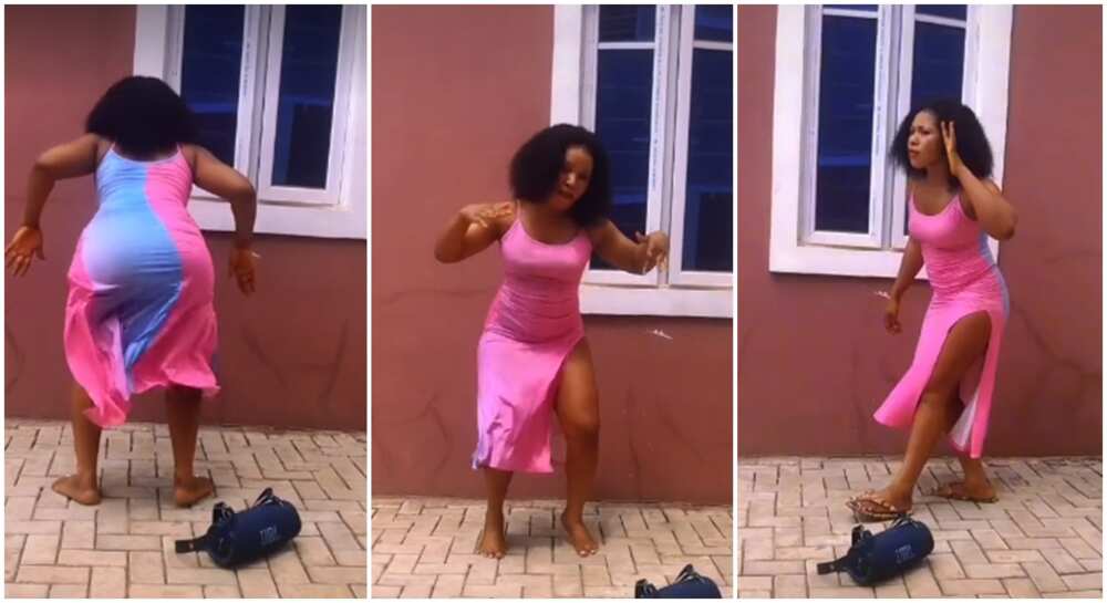Beautiful Nigerian lady with nice shape and in pink dress seen dancing with intense energy to Igbo traditional music.