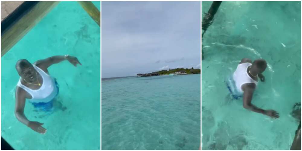 Obi Cubana swims at the Maldives.