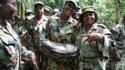 Female soldiers release photos carrying a big snake