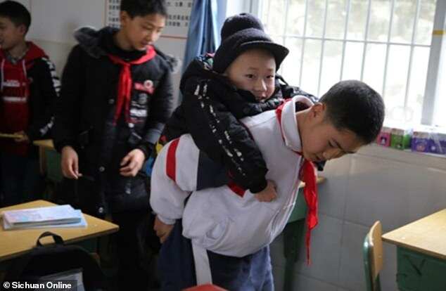 12-year-old schoolboy carries disabled friend to class daily for 6 years (photos)