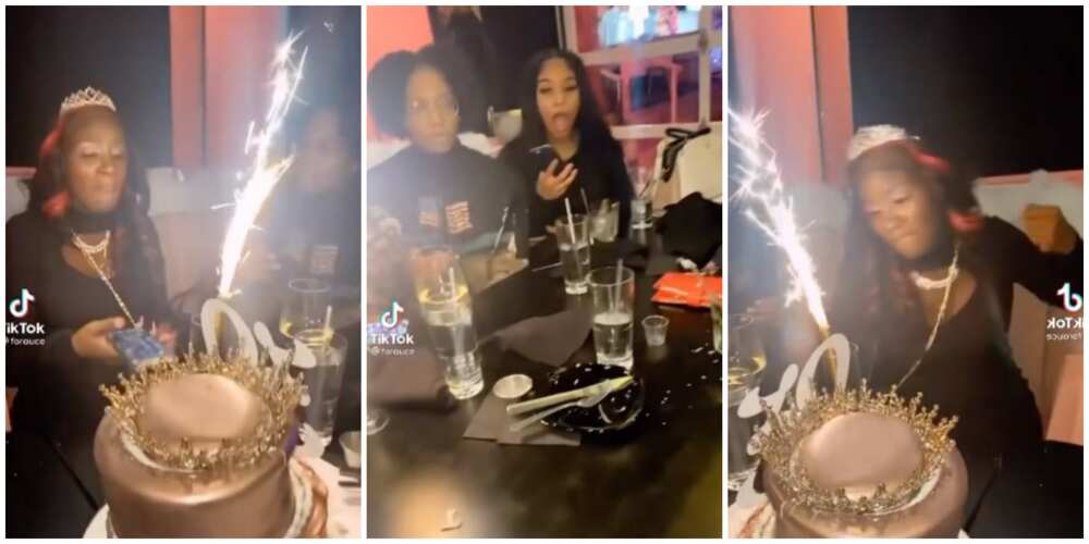 Drama at birthday dinner as female celebrant goes mad and destroys her cake in viral video