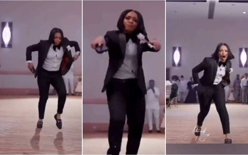 A beautiful groom's lady in black suit has made many people at a wedding reception with an amazing dance.