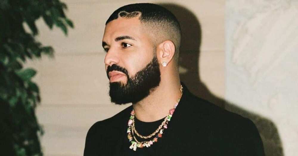 Drake Accepts Billboard Music Award's Artist of the Decade Award With Son Adonis Drake Accepts Billboard Music Award's Artist of the Decade Award With Son Adonis