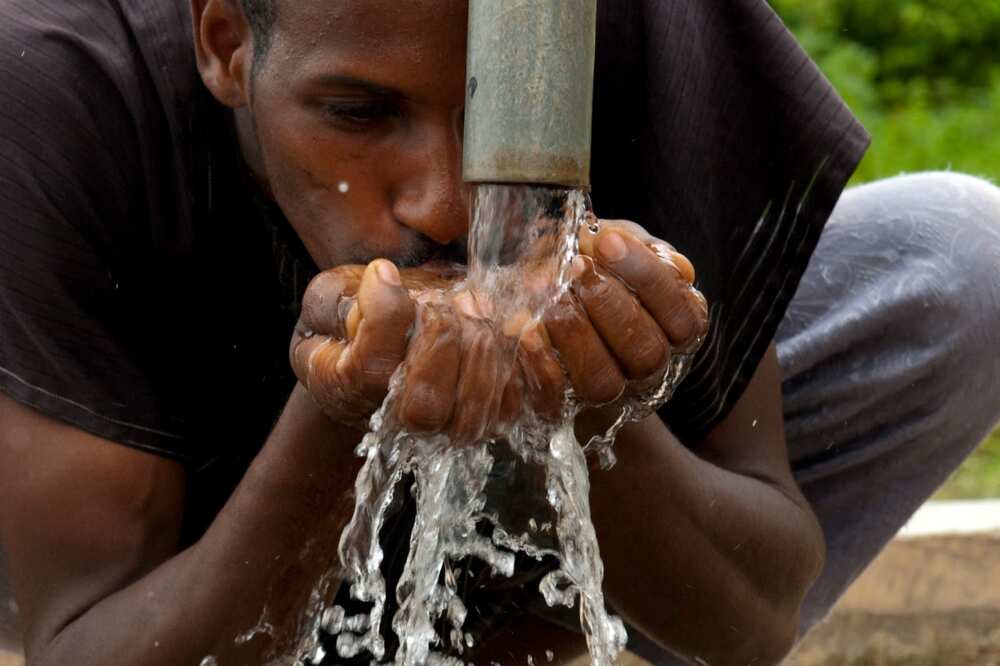 man drinks water