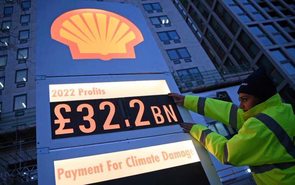 Greenpeace held a protest outside Shell's London HQ arguing it is "profiteering from climate destruction" Greenpeace held a protest outside Shell's London HQ arguing it is "profiteering from climate destruction"