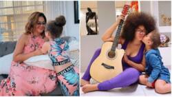 Nadia Buari shows front view of daughter as she covers eyes with dark sunglasses and gives her a kiss