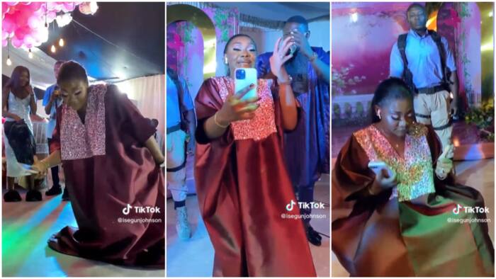 Nigerian lady with iPhone & AirPod dances with much confidence at party, man hypes her in viral video