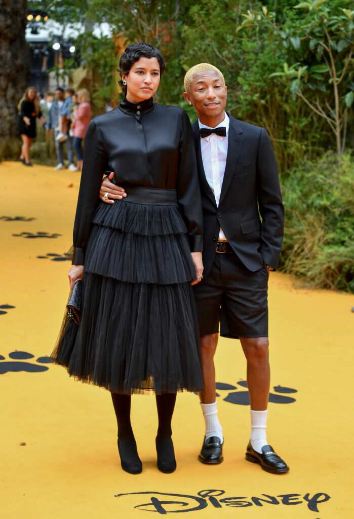 Pharrell Williams and his wife Helen Lasichanh attend the Chanel