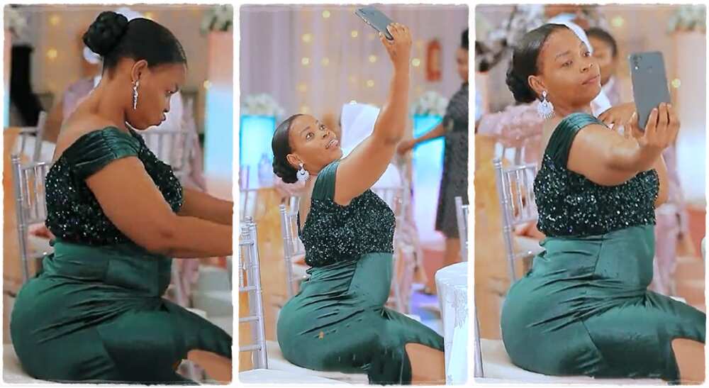 Photos of a lady dancing smoothly with waist while taking a selfie.