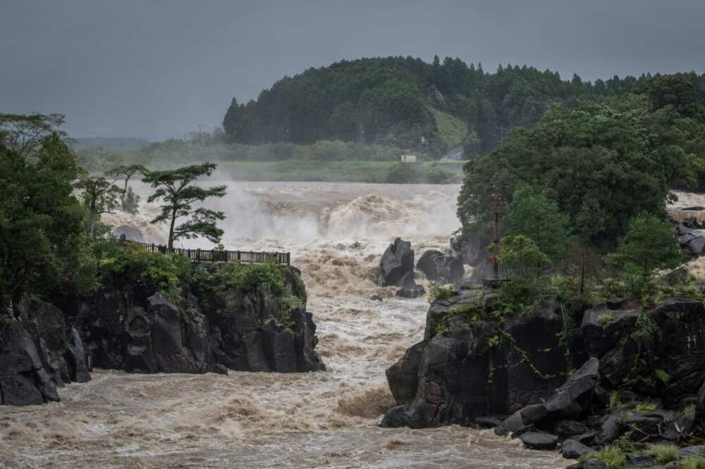 Heavy rainfall has left rivers in southwestern Japan swollen and authorities have warned flooding remains possible