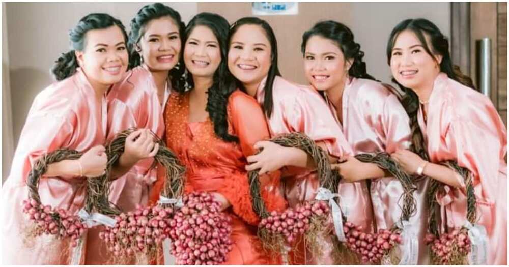 Filipino bride walks down the aisle with onion bouquet