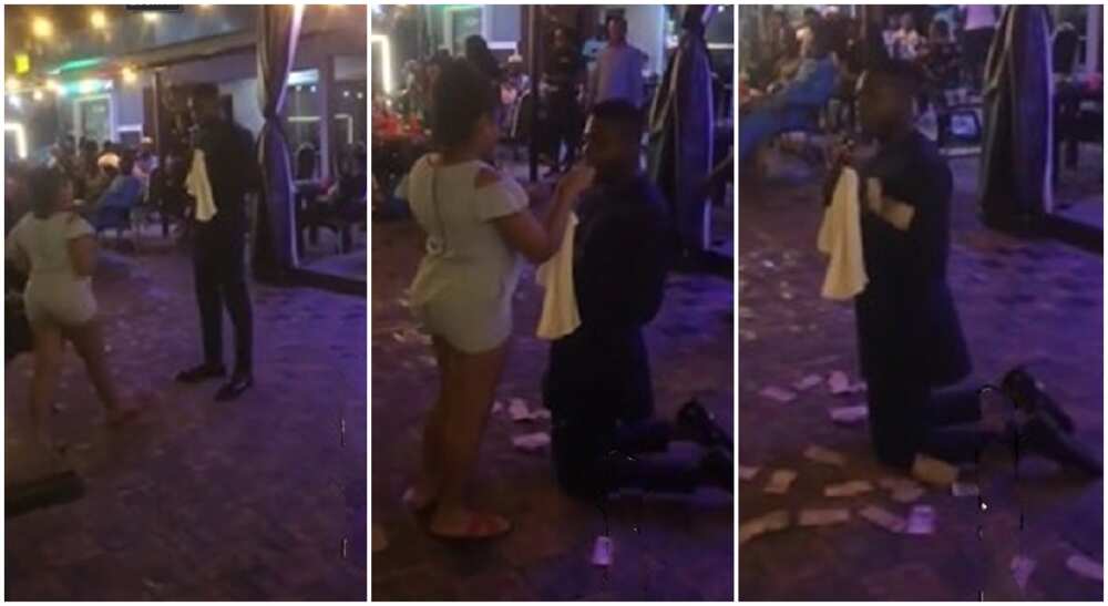 Nigerian girl sprays money as grown man kneels for her in viral video.