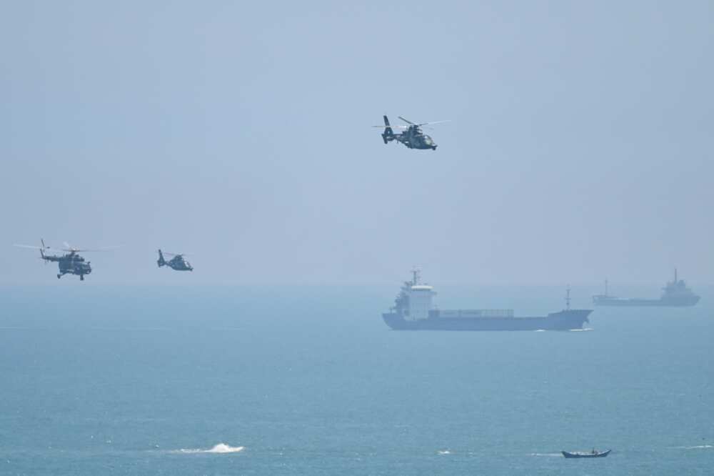 Chinese military helicopters fly past Pingtan island, one of mainland China's closest points to Taiwan, on August 4, 2022