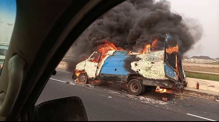 Articulated bus heavily laden with sacks is currently on fire in Lagos.