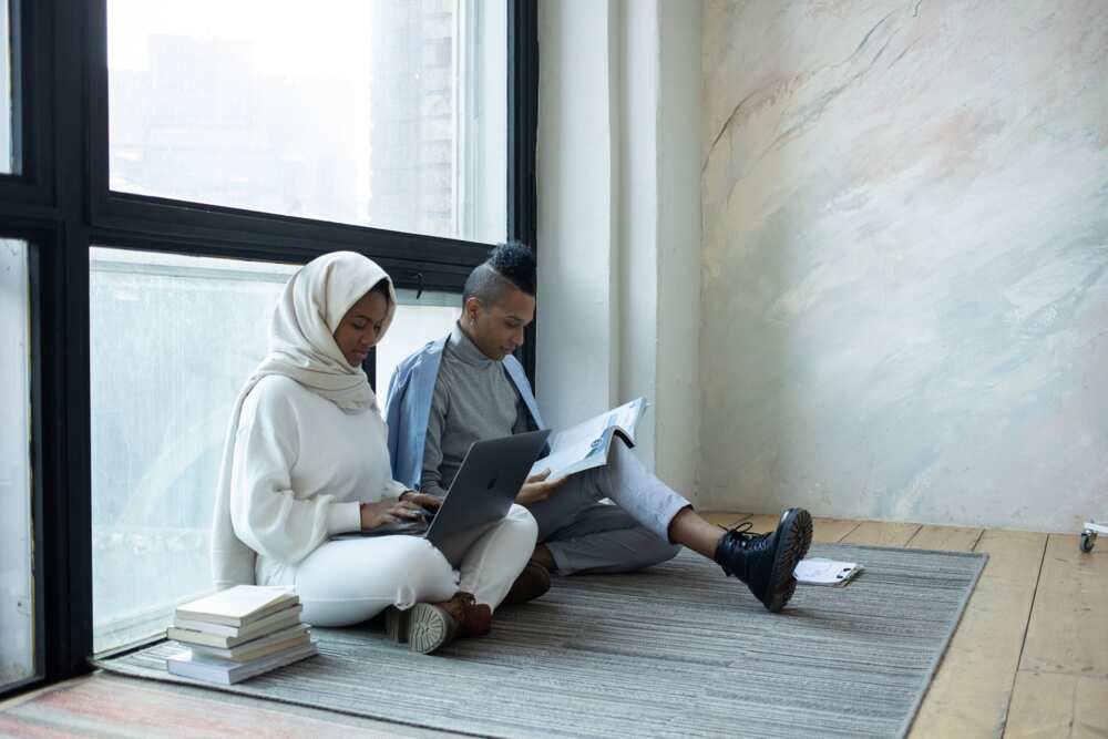 A male and female student studying