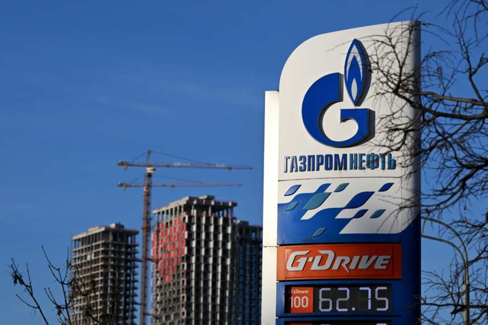 A view of a petrol station of the Russian oil producer Gazprom Neft and high-rise residential buildings under construction in Moscow on January 12, 2023