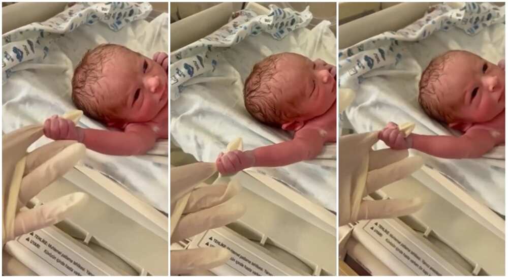 Photos of a baby holding the hand of a doctor.