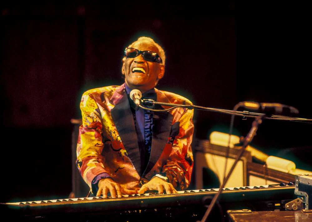 American R&B and Soul musician Ray Charles plays the piano while performing