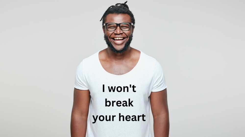 A man laughing while displaying white lie shirt ideas A man laughing while displaying white lie shirt ideas